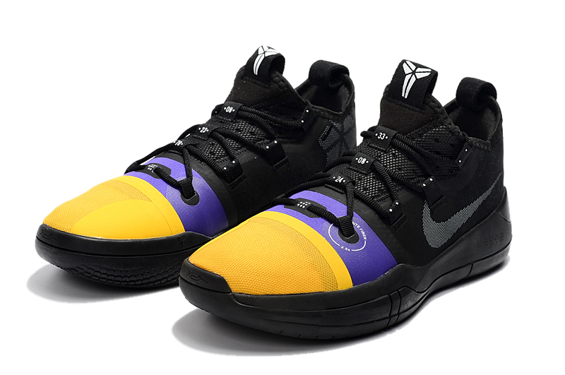 nike purple and yellow shoes