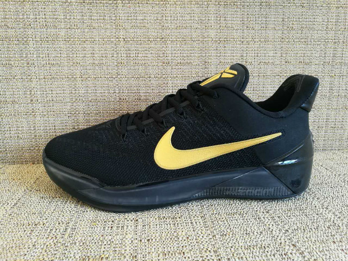 kobe gold and black shoes
