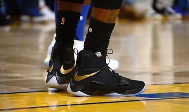 champion black and gold shoes